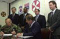 Image 15National Federation of Federal Employees officials sign a collective bargaining agreement with the U.S. 8th Army in October 2002.