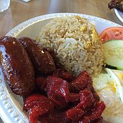 Filipino tosilog breakfast with tocino and longganisa