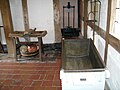 Display of butter-making equipment on the ground floor of the 16th-century farm.