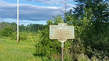 a picture of the marker showing an empty field behind it