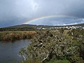 Western shore of Lake Seppings with Mount Adelaide and rainbow in the background