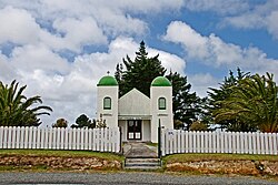 The Rātana Church at Te Kao is characterised by bell towers at each of the front corners, which bear the words "Arepa" and "Omeka" (Maori transliterations of the Greek words Alpha and Omega – the beginning and the end)[1]