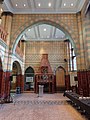 Main Hall, Victoria Building, University of Liverpool (1888), Gothic in style, with multicoloured faience covered walls, fireplace and balustrades, terrazzo floor with mosaic borders, this has some of the most ambitious schemes of coloured internal decoration of any of his buildings