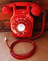 1970 741L Reproduction wall mounted telephone in red. These telephones were only issued to fire services and originally had no dial.