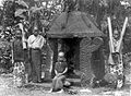 Girls at an offering house at the entrance of a kampong in South Nias