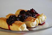 Blintzes / naleśniki filled with quark and garnished with blackberries