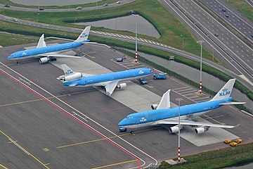 Three wide-body aircraft: KLM's Airbus A330 twinjet, McDonnell Douglas MD-11 trijet and Boeing 747-400 quadjet