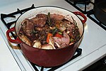 Coq au vin, a typical dish in French cuisine.