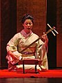 Image 71Fumie Hihara playing the shamisen, Guimet Museum, Paris (from Culture of Japan)