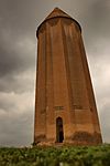 A tower topped with conical roof