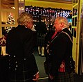 View of black Prince Charlie jackets from the back showing silver buttons