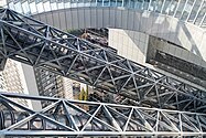 A view of the glass-layered escalator crossings from the Sky Deck