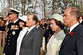Elizabeth II, Pierre Trudeau, the Duke of Edinburgh, and François and Danielle Mitterrand at the Bény-sur-Mer Canadian War Cemetery, France, 1984