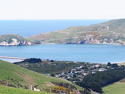 Looking east across the mouth of Otago Harbour; Aramoana settlement to the lower right