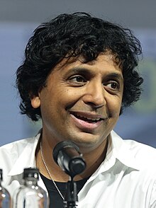 Shyamalan smiling