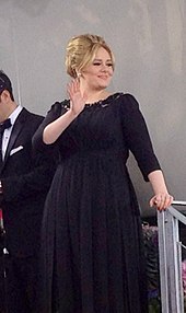 Adele in a black dress.