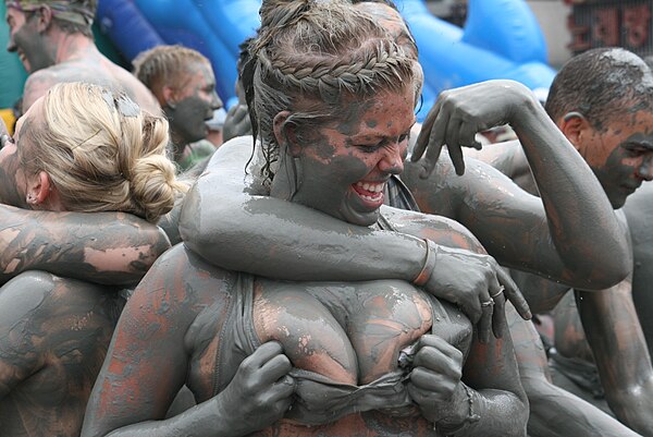 Mud wrestling, an erotic or sensual activity, not a formal sport.