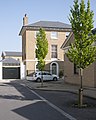 Newly planted Carpinus betulus 'Fastigiata' in Poundbury, Dorset, United Kingdom