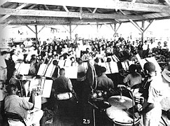 A military band entertains at the evacuee camp