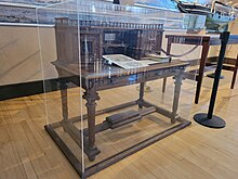 The Grinnell desk in a glass display case