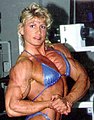 Nikki Fuller doing a side chest pose.