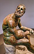 Bronze statue of a boxer resting after a bout