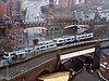 Two T-68 trams, numbers 2004 and 1019, crossing at Deansgate-Castlefield in 2006