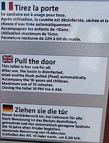 Public restroom sign with broken English and German directly translated from French.