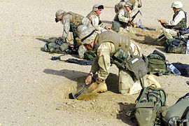 US Marines digging 'fighting holes' near the Iraqi border, 2003.