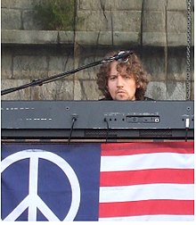 Adam MacDougall performing with The Black Crowes at the 2008 Newport Folk Festival.