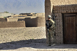 Australian Army Pvt. Brent Rothwell patrols in Tarin Kowt with an HK417, Uruzgan province, Afghanistan, July 26, 2013.