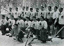 Outdoor photo of the Port Arthur Bearcats in hockey equipment wearing the Canadian national team uniform