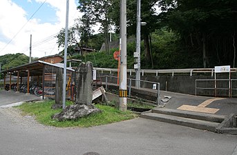 The entrance to Mikamo Station. Two steps are needed to get onto the ramp, rendering it difficult for wheelchair users. The bike shed can be seen to the left.