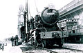 An ex-British Army WD Austerity 2-8-0 locomotive delivered to Hong Kong in 1947 for KCR British Section. The Clock Tower is visible in the background.