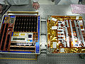 MISSE PEC5 being prepared for launch. On the left is FTCSE, on the right PcSat-2 covered and by a golden thermal blanket with the flexible materials samples