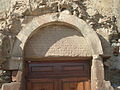 Inscription on the tympanum over the main portal.