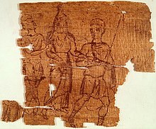Worn papyrus fragment. Two men and a woman are drawn in reddish ink.
