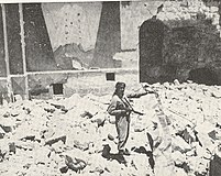 Arab Legion soldier standing in ruins of the most sacred Synagogue, the "Hurva", Old City.[167]