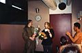 Mary Folberg receiving flowers from dancers in dressing room of Portland Center for the Performing Arts