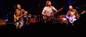 Moe tuning their instruments between songs on March 3, 2007. Left to right: Jim Loughlin, Chuck Garvey, Rob Derhak, Vinnie Amico, Al Schnier.