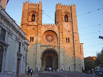 The imposing facade of Lisbon Cathedral, Portugal, The facade has two bell towers in the Norman manner and a wheel window.