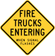 Wisconsin fire trucks entering when signal flashes sign.