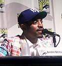 A man speaks to a microphone at the San Diego Comic Con.