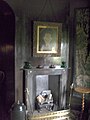 A view into the Oratory from the parlour, showing the fireplace and the portrait of "Dame Joan" Pendrell.
