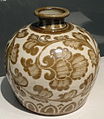 Chinese ding-ware porcelain bottle with iron-tinted pigment under a transparent colorless glaze, 11th century, Song Dynasty