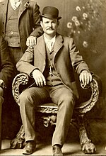 Butch Cassidy poses in the Wild Bunch group photo, Fort Worth, Texas, 1901.