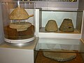 Quern-stones at Cliffe Castle Museum, showing central wooden spindle.