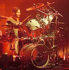 Collins performing with Genesis in 2022