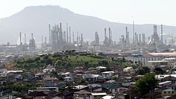 Panorama view of Hualpén, the Amarillo Hill (foreground), ENAP oil refinery, and the Teta Biobío Norte Hill in background.