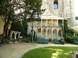 Flamboyant Gothic arches of the Chapel of the Virgin (13th c.) displayed in the Square next to the church